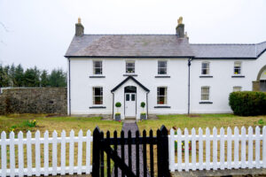 cnewr estate family farmhouse front view|Cnewr Estate family farmhouse bathroom|Cnewr Estate family farmhouse bedroom|Cnewr Estate family farmhouse kitchen|Fan cottage holiday rental brecon beacons bedroom|Cnewr Estate family farmhouse sitting room|Fan cottage holiday rental brecon beacons arial view with lake behind|Fan cottage holiday rental brecon beacons relaxation chair with book